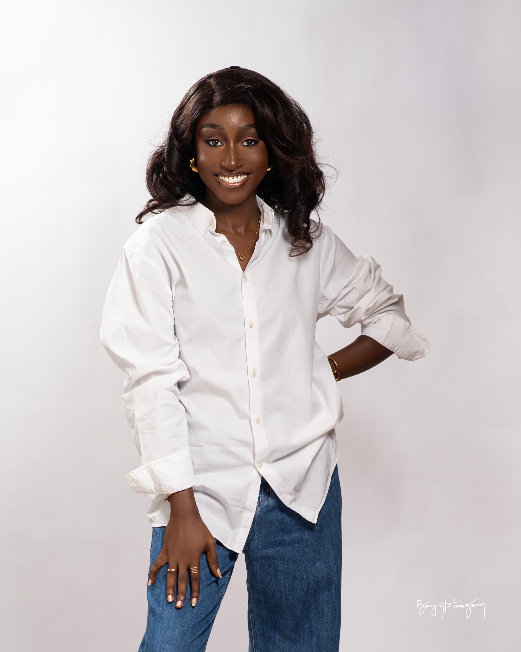 Tonnie, smiling, in a white shirt